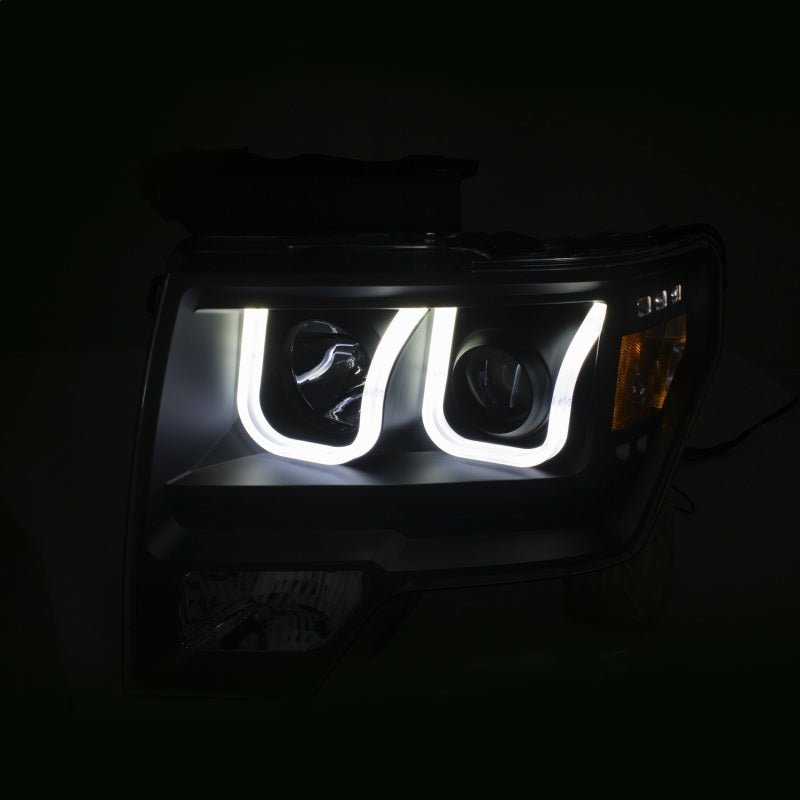 ANZO 2009-2014 Ford F-150 Projector Headlights w/ U-Bar Switchback Black w/ Amber - Crew Original