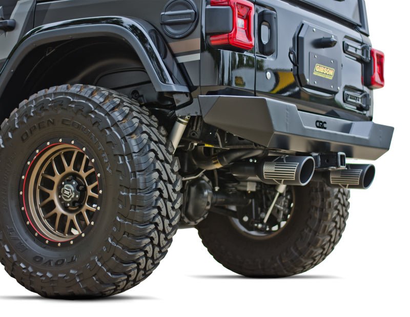 Gibson 12-17 Jeep Wrangler Sport 3.6L 2.5in Patriot Skull Series Cat-Back Dual Exhaust - Blk Ceramic - Crew Original